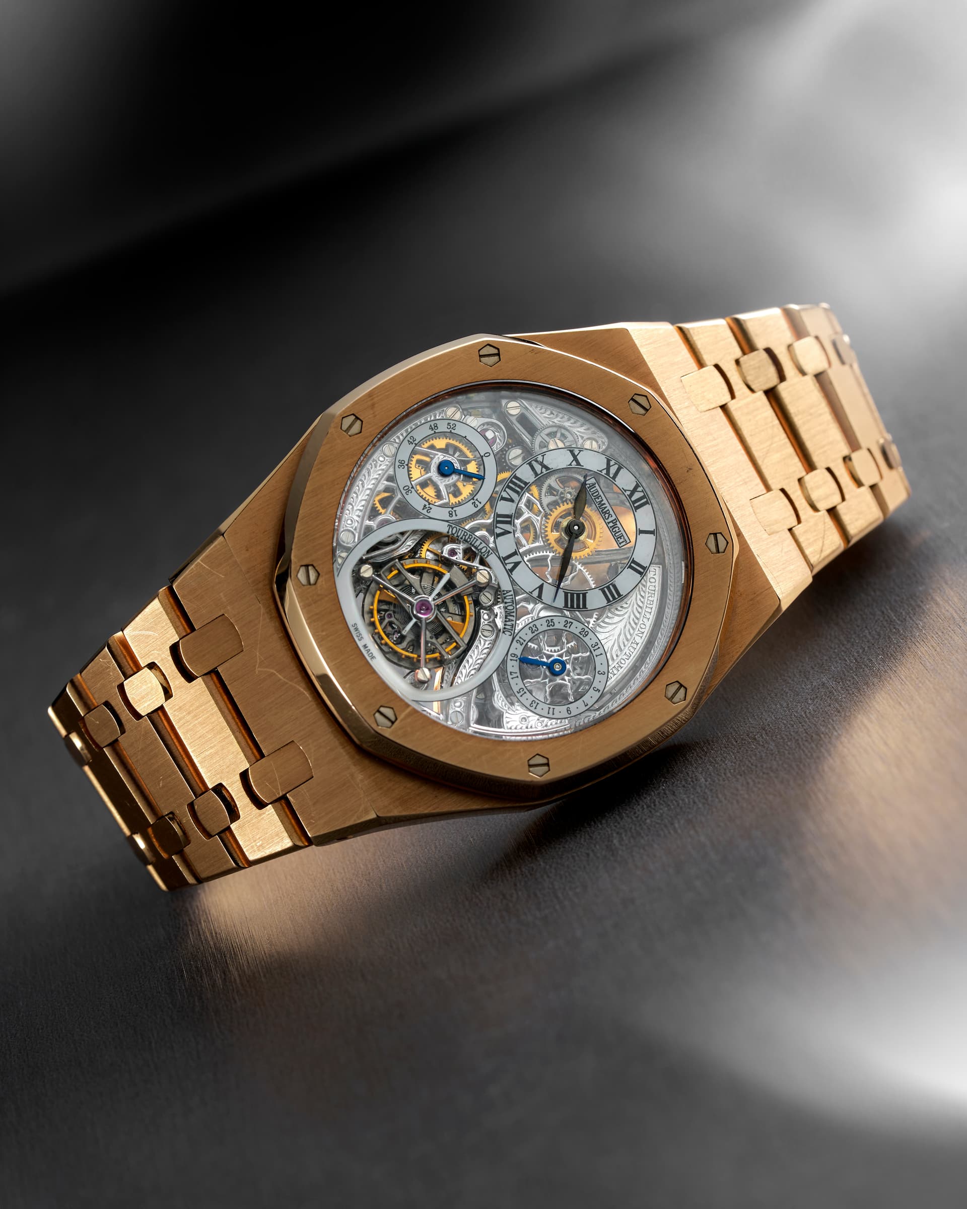 Audemars Piguet Royal Oak Tourbillon Squelette, yellow gold — Recumbent, showing case thickness and the taper of the bracelet's first links.