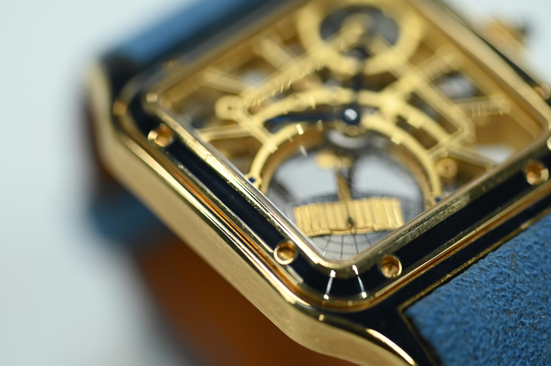 Cartier Santos-Dumont Skeleton — Dial detail: bridge-numerals, open architecture and rail-track minute chapter.