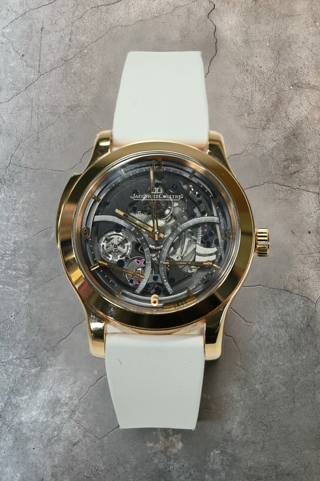 Jaeger-LeCoultre Master Grande Tradition skeletonised tourbillon in pink gold with torque and power reserve indications on a white strap