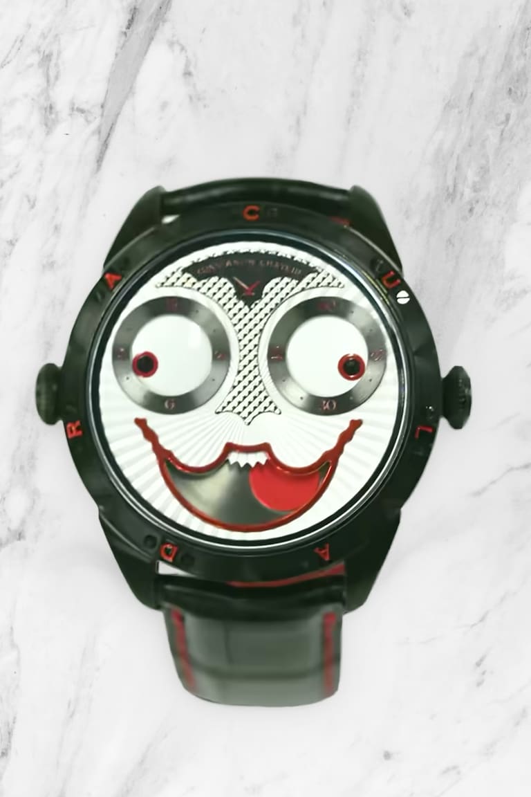 Konstantin Chaykin Joker in blackened steel, the dial reading as a face with regulator eyes and a red lacquer moonphase mouth