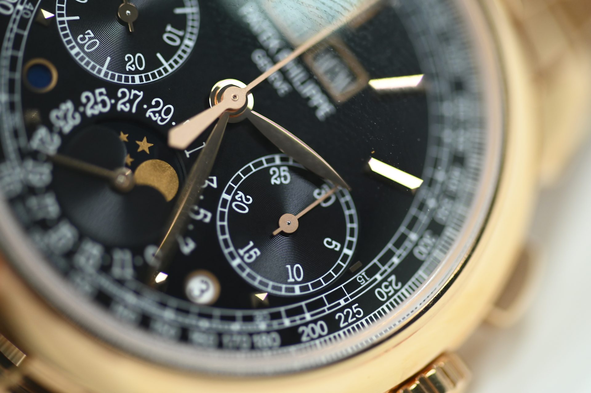 Patek Philippe Perpetual Calendar Chronograph 5270/1R — Dial detail: day and month apertures, moonphase, leap-year indication and tachymetre scale.