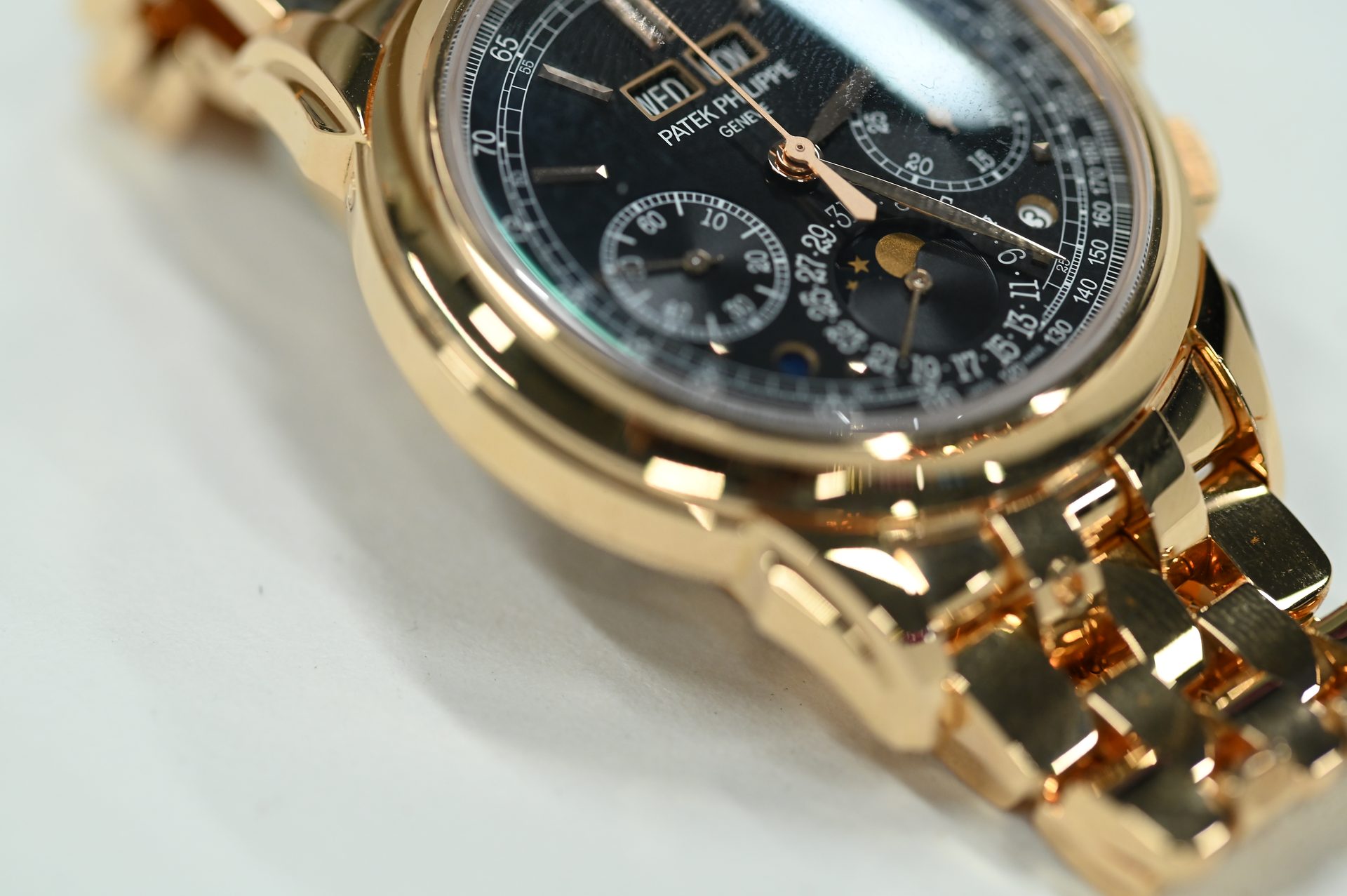 Patek Philippe Perpetual Calendar Chronograph 5270/1R — Three-quarter view showing case, bezel and bracelet taper.