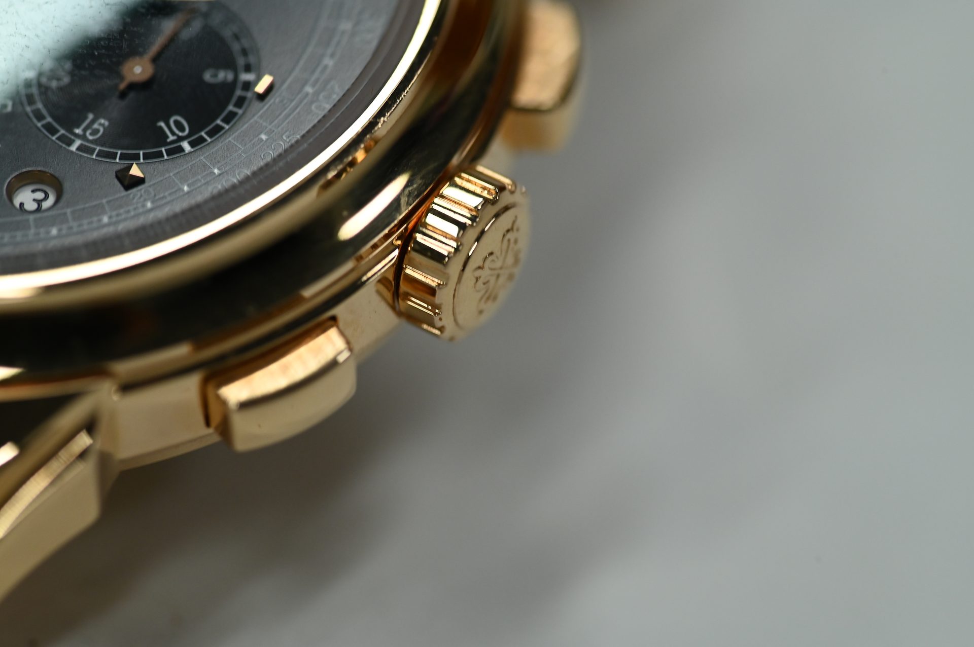 Patek Philippe Perpetual Calendar Chronograph 5270/1R — Case side with the fluted crown and chronograph pusher.
