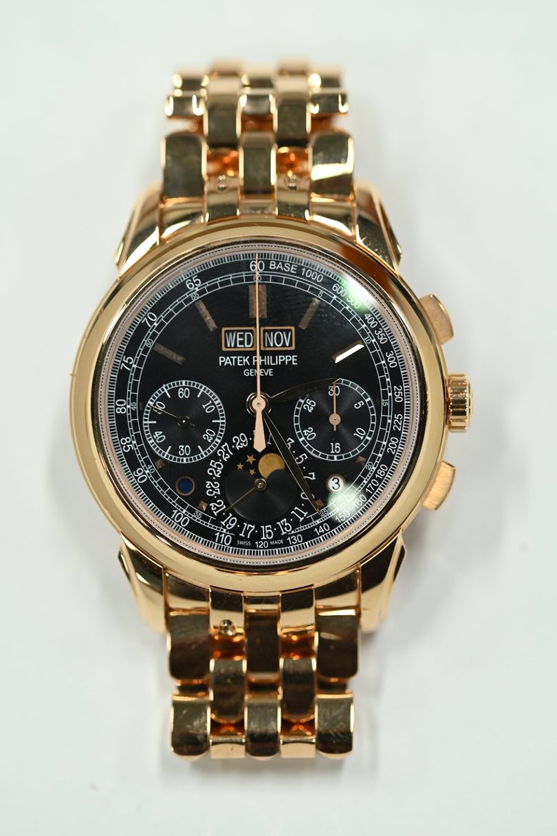 Patek Philippe 5270 perpetual calendar chronograph in rose gold with black dial, moonphase and integrated gold bracelet