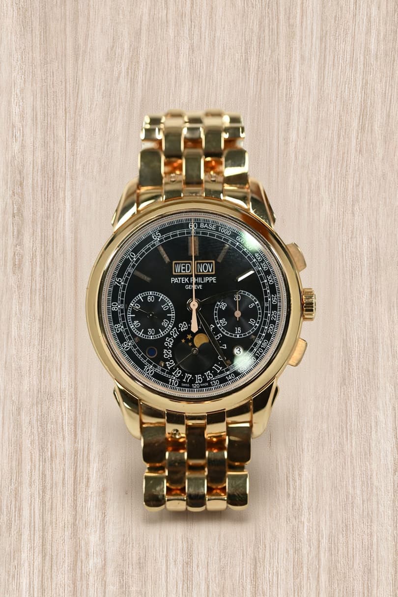 Patek Philippe 5270 perpetual calendar chronograph in rose gold with black dial, moonphase and integrated gold bracelet