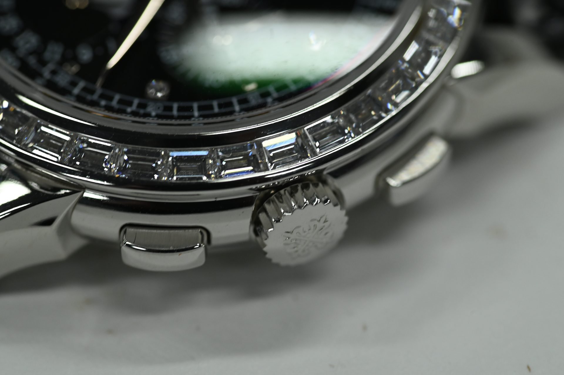 Patek Philippe Perpetual Calendar Chronograph, diamond-set — Bezel detail: invisibly channel-set baguette diamonds running the full circumference.