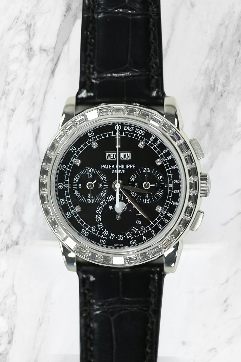 Patek Philippe perpetual calendar chronograph with black dial, baguette diamond bezel and diamond hour markers on black alligator