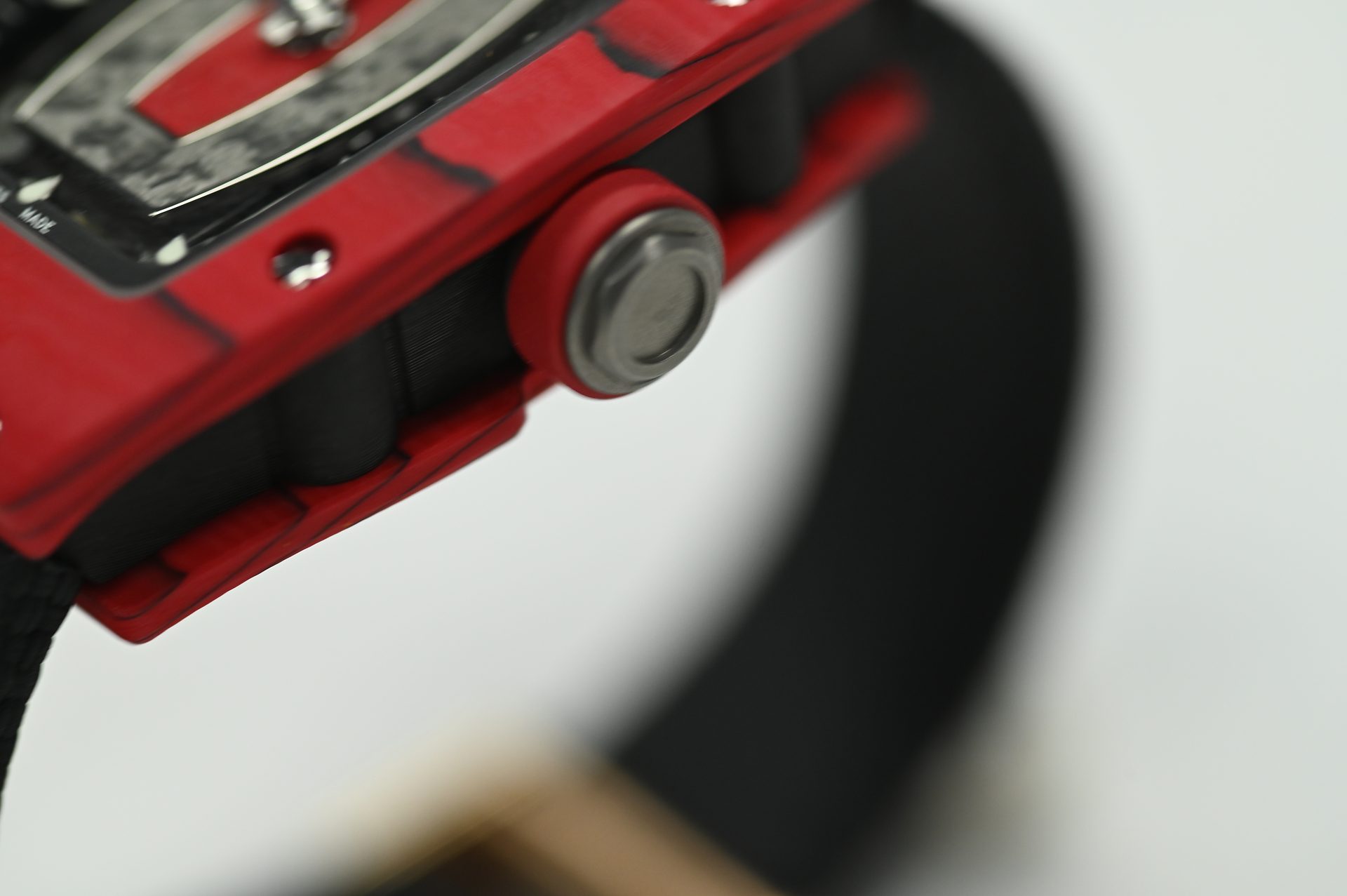 Richard Mille RM 07-01 Red Quartz TPT — Case side with the grooved crown and spline screws through the bezel.